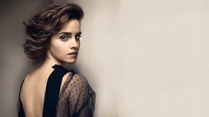 Emma Watson Looking Elegant In Backless Art Wallpaper