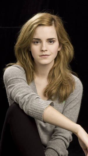 Emma Watson Looking Stylish In A Casual Setting Wallpaper