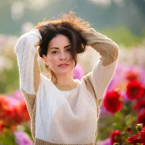 Emmanuelle Vaugier Posing In An Elegant Dress Against A Scenic Backdrop. Wallpaper