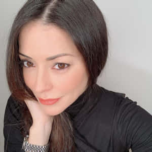 Emmanuelle Vaugier Radiating Elegance In A Black Dress Wallpaper