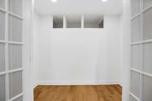 Empty Room With Windowed Doors Wallpaper