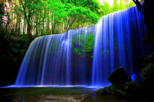 Enchanted_ Blue_ Waterfall Wallpaper