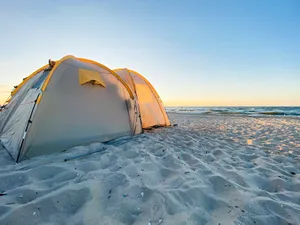 Enchanting Beach Camping Under Starry Skies Wallpaper