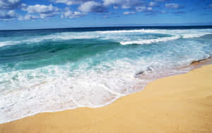 Enchanting Beach Waves Rolling Onto The Shore Wallpaper