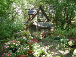 Enchanting Cottage Garden In Full Bloom Wallpaper