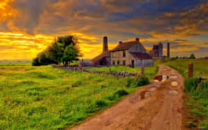 Enchanting Fall Farmhouse Amidst Colorful Autumn Landscape Wallpaper