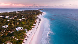 Enchanting Pink Beach Paradise At Sunset Wallpaper