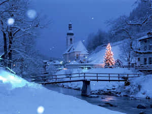 Enchanting Snowy Village In Winter Wonderland Wallpaper