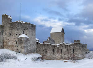 Enchanting Sunset In Medieval Visby Wallpaper