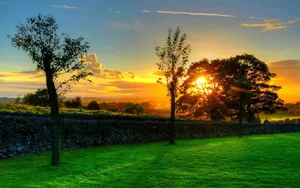 Enchanting Sunset View At A Picturesque Landscape Wallpaper