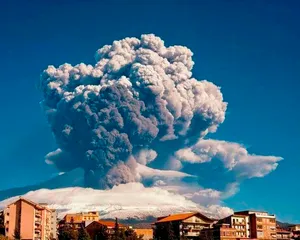 Enchanting View Of Sicilian Village With Mount Etna In Background Wallpaper