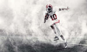 Energetic Alabama Football Team Player Wallpaper