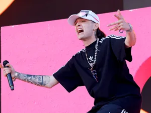 Energetic Performance Artist Microphone Wallpaper