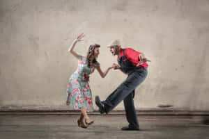 Energetic Swing Dancers Showcasing Classic Moves Wallpaper