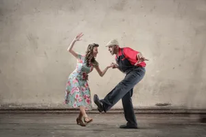 Energetic Swing Dancers Showcasing Classic Moves Wallpaper