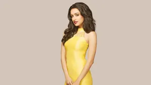 Engrossing Snapshot Of Shraddha Kapoor In A Yellow Dress Wallpaper