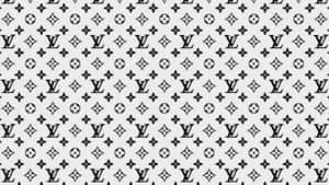 Enhance Your Look With The Timeless Elegance Of Louis Vuitton Print Wallpaper