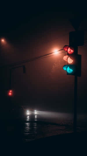 Enigmatic Dark Road At Night Wallpaper