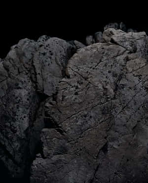 Enigmatic Dark Rock Formation Wallpaper