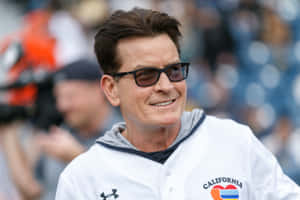 Enigmatic Gaze Of Charlie Sheen Wallpaper