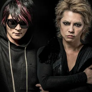 Enigmatic Visual Kei Performer With Intense Red Hair Wallpaper