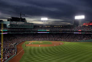 Enjoy A Baseball Game In The Iconic Fenway Park Wallpaper