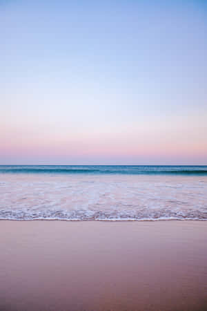 Enjoy A Blissful Day Of Rest And Relaxation At The Tranquil Pastel Beach. Wallpaper