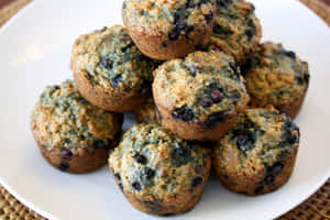 Enjoy A Delicious And Nutritious Blueberry Muffin Wallpaper