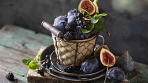 Enjoy A Delicious Basket Of Fresh Purple Figs Wallpaper