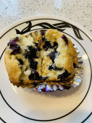 Enjoy A Delicious Batch Of Freshly-made Blueberry Muffins. Wallpaper