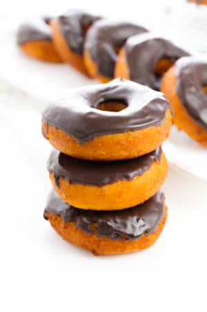 Enjoy A Delicious Glazed Donut Any Time Of The Day. Wallpaper