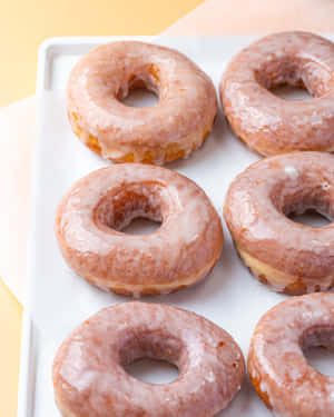 Enjoy A Delicious Glazed Donut Wallpaper