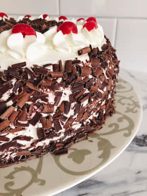 Enjoy A Delicious Piece Of Black Forest Cake Wallpaper