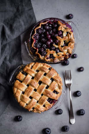 Enjoy A Delicious Slice Of Homemade Blueberry Pie Wallpaper