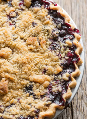 Enjoy A Slice Of Homemade Blueberry Pie Wallpaper