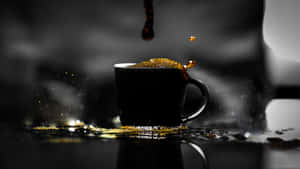 Enjoy A Smooth And Delicious Cup Of Black Coffee Wallpaper
