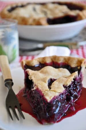 Enjoy A Sweet Slice Of Blueberry Pie Wallpaper