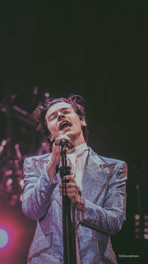 Enjoy Listening Music While You're On-the-go With The Harry Styles Iphone Wallpaper