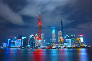 Enjoy The Beautiful Cityscape With Its Neon Lights Wallpaper