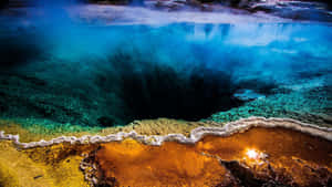 Enjoy The Breathtaking View Of Old Faithful In Yellowstone National Park Wallpaper