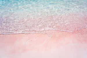 Enjoy The Calming Beauty Of A Pink Beach. Wallpaper