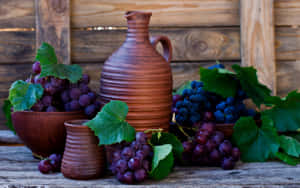 Enjoy The Delicious Sweetness Of Purple Grapes. Wallpaper