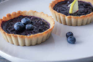 Enjoy The Delicious Taste Of Blueberry Tart Wallpaper