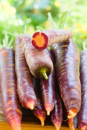 Enjoy The Distinctive Crunchy Texture, Earthy Sweetness, And Vibrant Purple Color Of This Purple Carrot Wallpaper