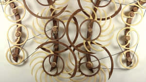 Enjoy The Movement Of Kinetic Art Wallpaper