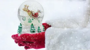 Enjoy The Peace And Beauty Of A Christmas Snow Fall. Wallpaper