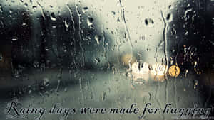 Enjoy The Rainy Day With Inspiring Quotes Wallpaper