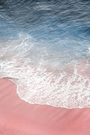 Enjoy The Soft, Dreamy Hues Of A Pink Beach Aesthetic Wallpaper