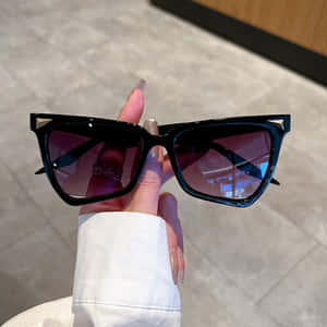 Enjoy The Summer Sun In Stylish Purple Sunglasses Wallpaper