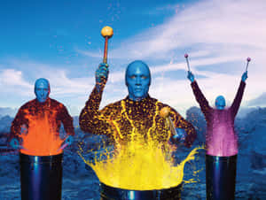 Enjoy The Thrill Of The Theatrical Experience With Blue Man Group Wallpaper